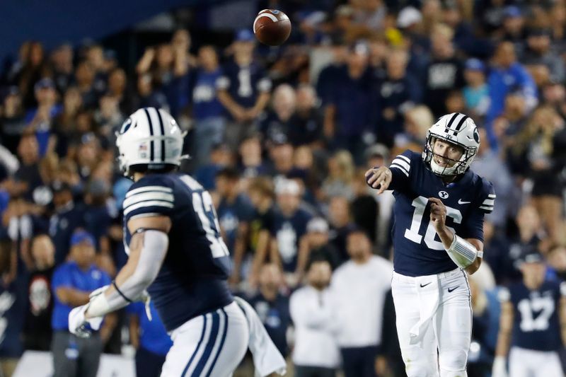 Sep 25, 2021; Provo, Utah, USA; Brigham Young Cougars quarterback Baylor Romney (16) passes to fullback Masen Wake (13) in the second quarter against the South Florida Bulls at LaVell Edwards Stadium. Mandatory Credit: Jeffrey Swinger-USA TODAY Sports