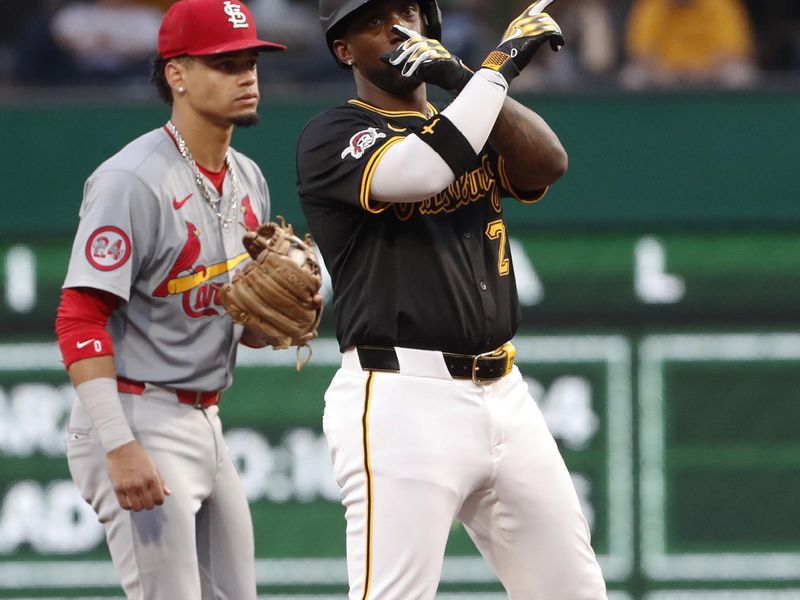 Jul 3, 2024; Pittsburgh, Pennsylvania, USA;  Pittsburgh Pirates designated hitter Andrew McCutchen (right) reacts at second after hitting a double against the St. Louis Cardinals during the sixth inning at PNC Park. Mandatory Credit: Charles LeClaire-USA TODAY Sports