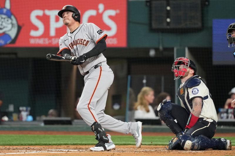 Jun 7, 2024; Arlington, Texas, USA; San Francisco Giants first baseman Wilmer Flores (41) follows through on his home run against the Texas Rangers during the fourth inning at Globe Life Field. Mandatory Credit: Jim Cowsert-USA TODAY Sports