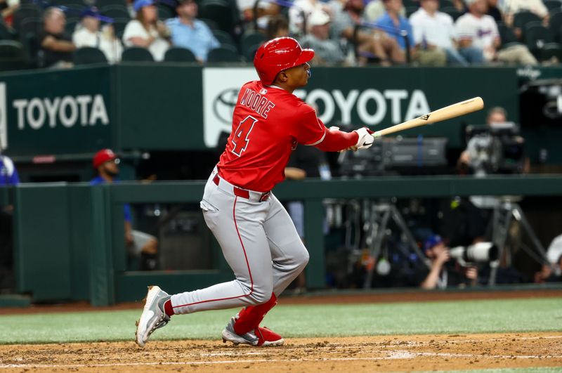 Aug 27, 2025; Arlington, Texas, USA;  Los Angeles Angels second baseman Christian Moore (4) hits a home run during the fifth inning against the Texas Rangers at Globe Life Field. Mandatory Credit: Kevin Jairaj-Imagn Images