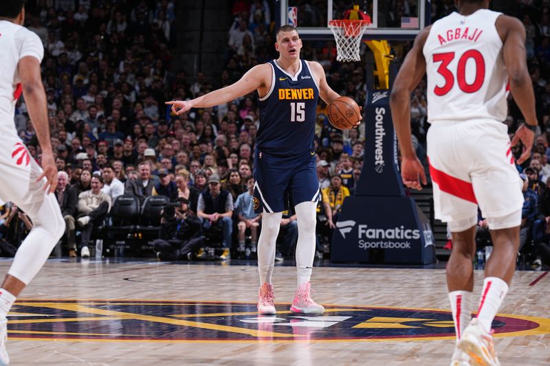 DENVER, CO - MARCH 11: Nikola Jokic #15 of the Denver Nuggets handles the ball during the game against the Toronto Raptors on March 11, 2024 at the Ball Arena in Denver, Colorado. NOTE TO USER: User expressly acknowledges and agrees that, by downloading and/or using this Photograph, user is consenting to the terms and conditions of the Getty Images License Agreement. Mandatory Copyright Notice: Copyright 2024 NBAE (Photo by Garrett Ellwood/NBAE via Getty Images)