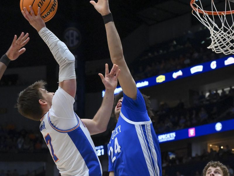 Mar 13, 2026; Nashville, TN, USA;  Florida Gators guard Urban Klavzar (7) shoots over Kentucky Wildcats center Malachi Moreno (24) during the first half at Bridgestone Arena. Mandatory Credit: Steve Roberts-Imagn Images