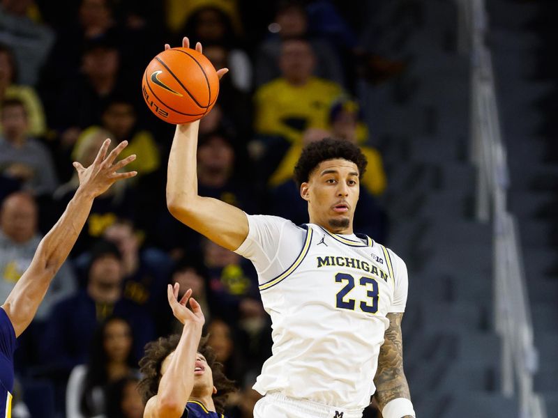 Dec 21, 2025; Ann Arbor, Michigan, USA; Michigan Wolverines forward Yaxel Lendeborg (23) recovers a rebound during the second half against the La Salle University Explorers at Crisler Center. Mandatory Credit: Brian Bradshaw Sevald-Imagn Images