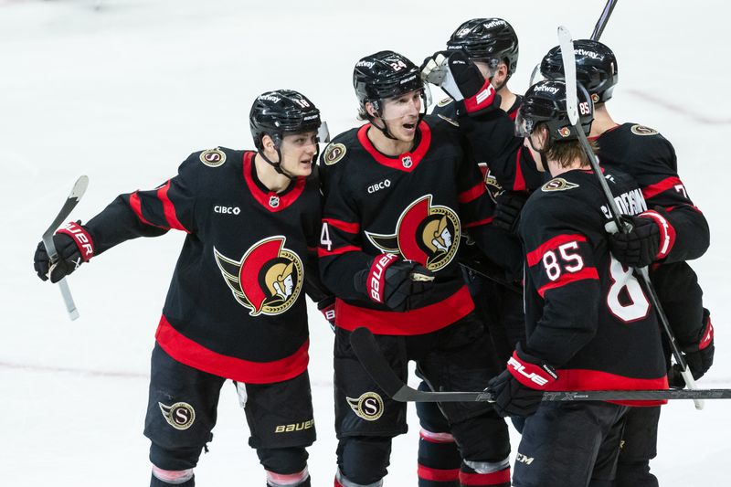 Mar 10, 2025; Ottawa, Ontario, CAN; Ottawa Senators center Dylan Cozens (24) celebrates with team his goal scored in the third period against the Detroit Red Wings at the Canadian Tire Centre. Mandatory Credit: Marc DesRosiers-Imagn Images