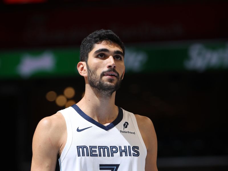 MEMPHIS, TN - OCTOBER 10: Santi Aldama #7 of the Memphis Grizzlies looks on during the game against the Charlotte Hornets during a NBA Preseason game on October 10, 2024 at FedExForum in Memphis, Tennessee. NOTE TO USER: User expressly acknowledges and agrees that, by downloading and or using this photograph, User is consenting to the terms and conditions of the Getty Images License Agreement. Mandatory Copyright Notice: Copyright 2024 NBAE (Photo by Joe Murphy/NBAE via Getty Images)