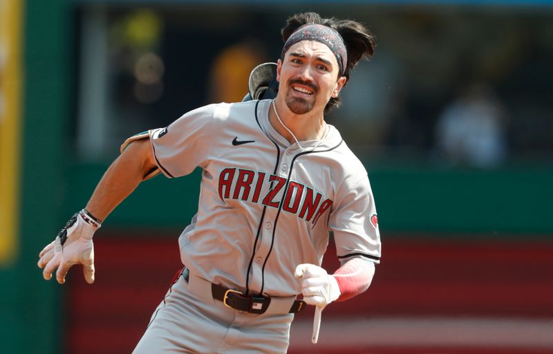 Aug 4, 2024; Pittsburgh, Pennsylvania, USA;  Arizona Diamondbacks right fielder Corbin Carroll (7) runs to third base with a triple against the Pittsburgh Pirates during the sixth inning at PNC Park. Mandatory Credit: Charles LeClaire-USA TODAY Sports