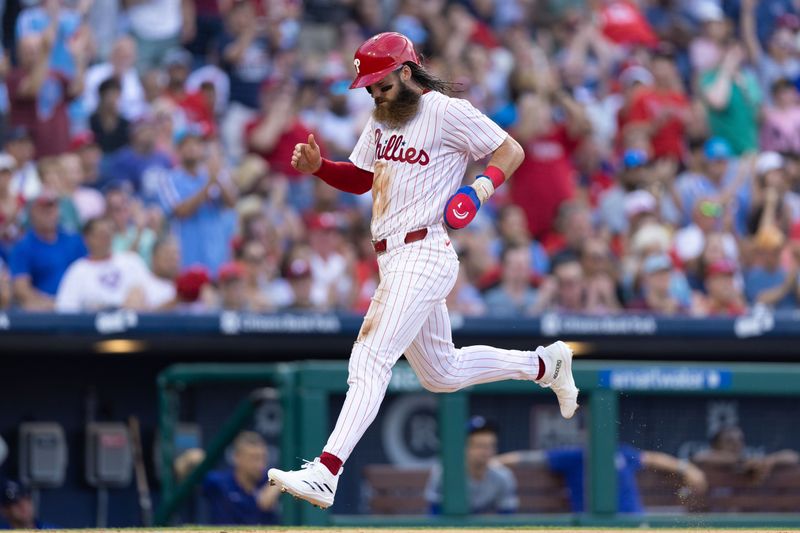 Jul 9, 2024; Philadelphia, Pennsylvania, USA; Philadelphia Phillies outfielder Brandon Marsh (16) scores during the second inning against the Los Angeles Dodgers at Citizens Bank Park. Mandatory Credit: Bill Streicher-USA TODAY Sports