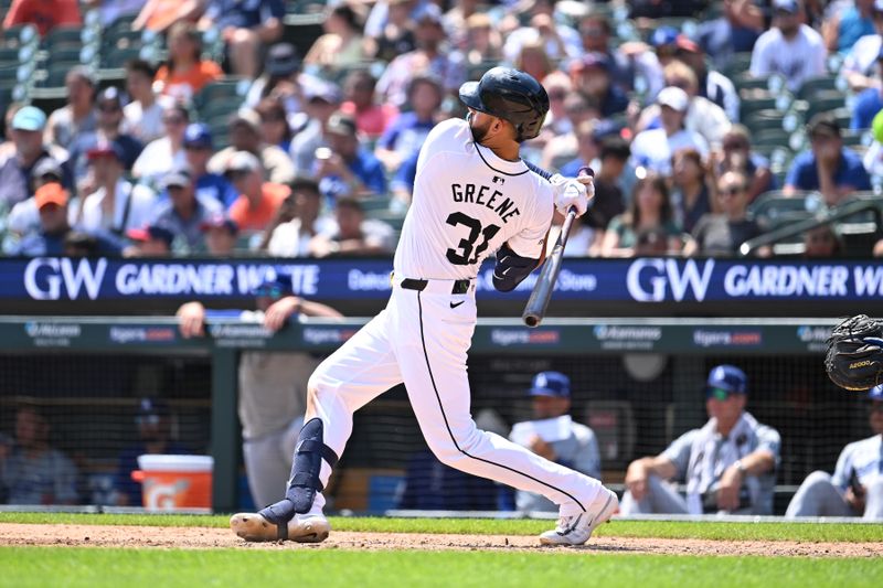 Jul 13, 2024; Detroit, Michigan, USA; Detroit Tigers center fielder Riley Greene (31) hits a double against the Los Angeles Dodgers in the seventh inning at Comerica Park. Mandatory Credit: Lon Horwedel-USA TODAY Sports