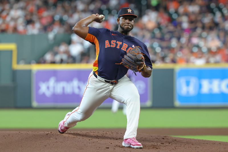 May 11, 2025; Houston, Texas, USA; Houston Astros starting pitcher Ronel Blanco (56) delivers a pitch during the second inning against the Cincinnati Reds at Daikin Park. Mandatory Credit: Troy Taormina-Imagn Images