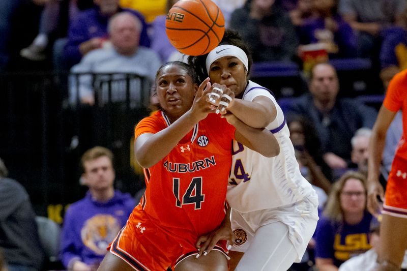 Feb 22, 2024; Baton Rouge, Louisiana, USA; LSU Lady Tigers guard Aneesah Morrow (24) and Auburn Tigers forward Taylen Collins (14) battle for a rebound during the first half at Pete Maravich Assembly Center. Mandatory Credit: Matthew Hinton-USA TODAY Sports