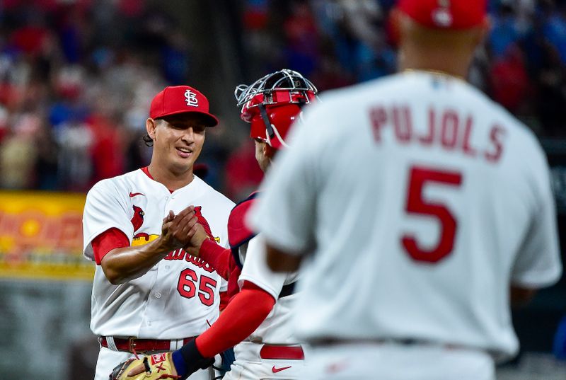 Apr 12, 2022; St. Louis, Missouri, USA;  St. Louis Cardinals relief pitcher Giovanny Gallegos (65) celebrates with catcher Andrew Knizner (7) after the Cardinals defeated the Kansas City Royals at Busch Stadium. Mandatory Credit: Jeff Curry-USA TODAY Sports