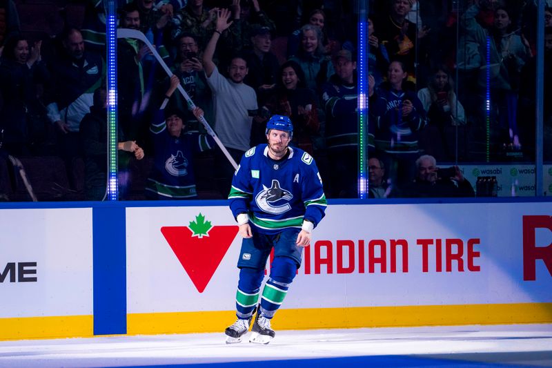 Nov 12, 2024; Vancouver, British Columbia, CAN; Vancouver Canucks forward J.T. Miller (9) gives a stick to a fan for being named the game’s third star after the Canucks defeated the Calgary Flames at Rogers Arena. Mandatory Credit: Bob Frid-Imagn Images