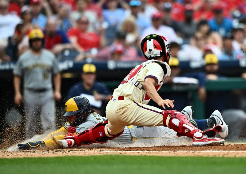 Jun 5, 2024; Philadelphia, Pennsylvania, USA; Philadelphia Phillies catcher Garrett Stubbs (21) tags out Milwaukee Brewers catcher William Contreras (24) at home in the seventh inning at Citizens Bank Park. Mandatory Credit: Kyle Ross-USA TODAY Sports