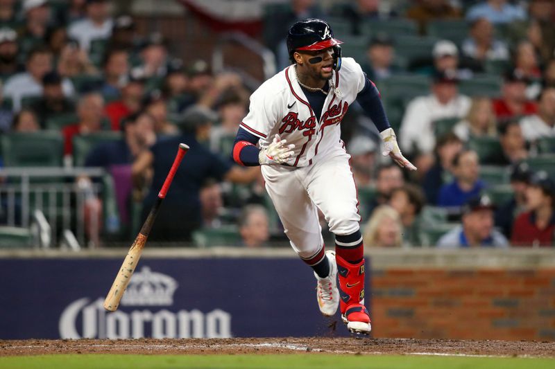 Oct 12, 2022; Atlanta, Georgia, USA; Atlanta Braves right fielder Ronald Acuna Jr. (13) tosses his bat after hitting a single against the Philadelphia Phillies in the fourth inning during game two of the NLDS for the 2022 MLB Playoffs at Truist Park. Mandatory Credit: Brett Davis-USA TODAY Sports