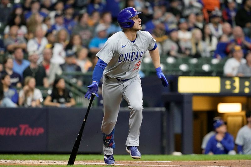 May 28, 2024; Milwaukee, Wisconsin, USA;  Chicago Cubs first baseman Michael Busch (29) hits a home run during the third inning against the Milwaukee Brewers at American Family Field. Mandatory Credit: Jeff Hanisch-USA TODAY Sports