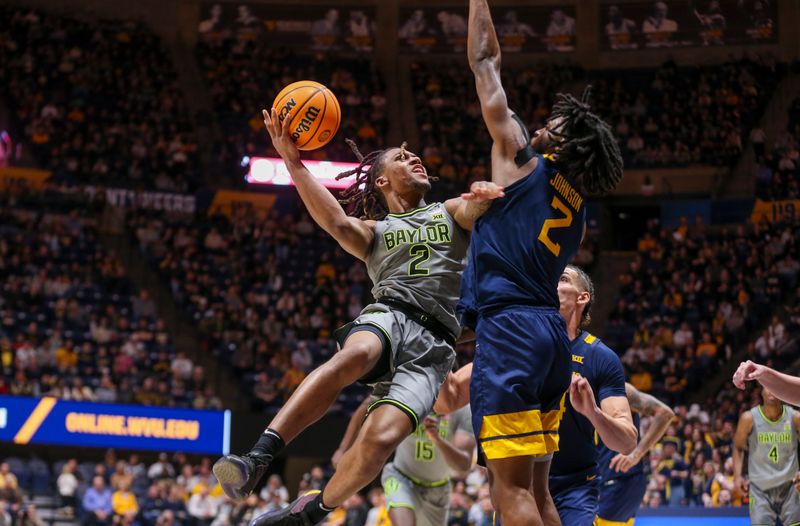 Feb 17, 2024; Morgantown, West Virginia, USA; Baylor Bears guard Jayden Nunn (2) shoots against West Virginia Mountaineers guard Kobe Johnson (2) during the first half at WVU Coliseum. Mandatory Credit: Ben Queen-USA TODAY Sports