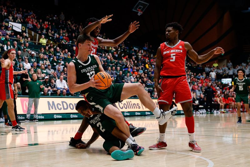 Mar 3, 2023; Fort Collins, Colorado, USA; Colorado State Rams forward Patrick Cartier (12) grabs a rebound against New Mexico Lobos forward Morris Udeze (24) as guard Tavi Jackson (2) looks on from the floor and guard Jamal Mashburn Jr. (5) defends in the second half at Moby Arena. Mandatory Credit: Isaiah J. Downing-USA TODAY Sports