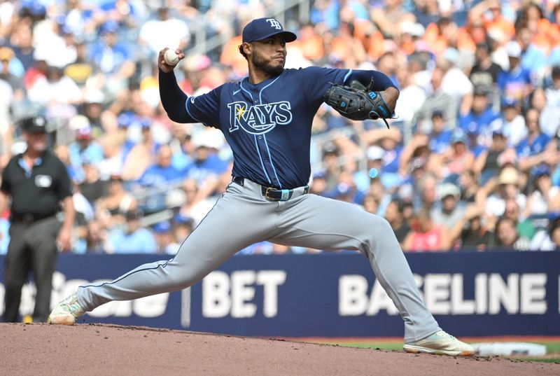 Jul 25, 2024; Toronto, Ontario, CAN; Tampa Bay Rays starting pitcher Taj Bradley (45) deliver against the Toronto Blue Jays in the first inning at Rogers Centre. Mandatory Credit: Dan Hamilton-USA TODAY Sports