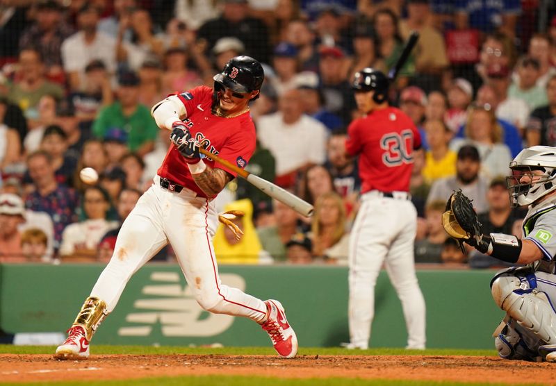 Aug 26, 2024; Boston, Massachusetts, USA; Boston Red Sox center fielder Jarren Duran (16) hits a two run home run against the Toronto Blue Jays in the eighth inning at Fenway Park. Mandatory Credit: David Butler II-USA TODAY Sports