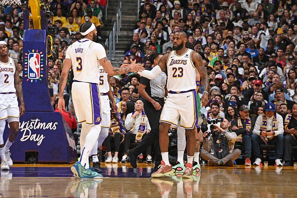 LOS ANGELES, CA - DECEMBER 25: Anthony Davis #3 high fives LeBron James #23 of the Los Angeles Lakers during the game against the Boston Celtics on December 25, 2023 at Crypto.Com Arena in Los Angeles, California. NOTE TO USER: User expressly acknowledges and agrees that, by downloading and/or using this Photograph, user is consenting to the terms and conditions of the Getty Images License Agreement. Mandatory Copyright Notice: Copyright 2023 NBAE (Photo by Andrew D. Bernstein/NBAE via Getty Images)