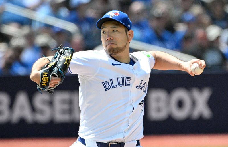 Jun 6, 2024; Toronto, Ontario, CAN;  Toronto Blue Jays starting pitcher Yusei Kikuchi (16) delivers a pitch against the Baltimore Orioles in the fifth inning at Rogers Centre. Mandatory Credit: Dan Hamilton-USA TODAY Sports