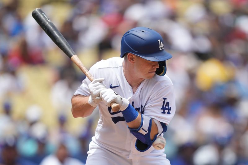 Jul 30, 2023; Los Angeles, California, USA; Los Angeles Dodgers catcher Will Smith (16) is hit by a pitch in the first inning against the Cincinnati Reds at Dodger Stadium. Mandatory Credit: Kirby Lee-USA TODAY Sports