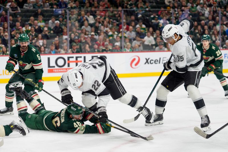 Oct 13, 2025; Saint Paul, Minnesota, USA; Minnesota Wild defenseman Jared Spurgeon (46) blocks the path of Los Angeles Kings left wing Kevin Fiala (22) and right wing Quinton Byfield (55) in the third period at Grand Casino Arena. Mandatory Credit: Matt Blewett-Imagn Images