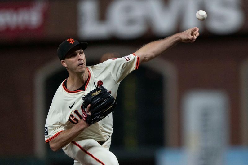 Sep 4, 2024; San Francisco, California, USA;  San Francisco Giants pitcher Taylor Rogers (33) pitches during the eighth inning against the Arizona Diamondbacks at Oracle Park. Mandatory Credit: Stan Szeto-Imagn Images