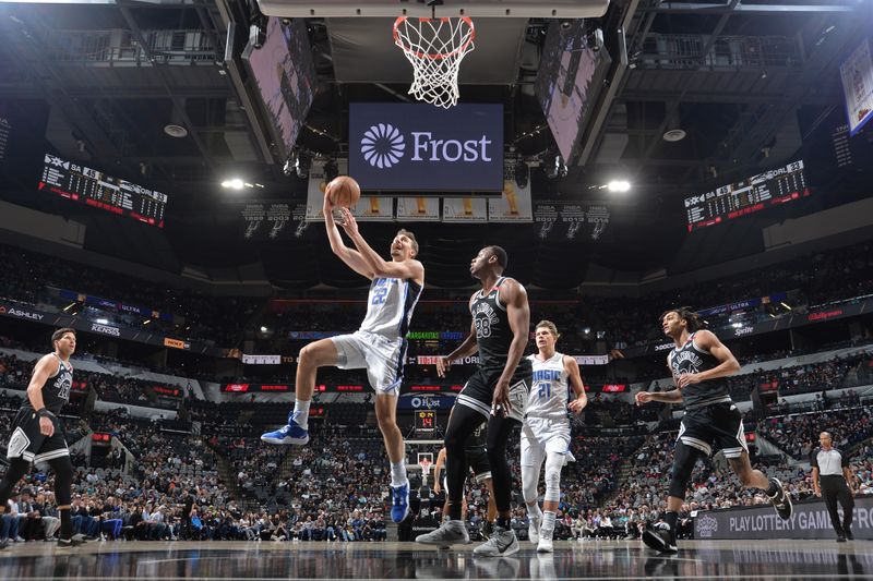 SAN ANTONIO, TX - MARCH 14: Franz Wagner #22 of the Orlando Magic drives to the basket during the game against the San Antonio Spurs on March 14, 2023 at the AT&T Center in San Antonio, Texas. NOTE TO USER: User expressly acknowledges and agrees that, by downloading and or using this photograph, user is consenting to the terms and conditions of the Getty Images License Agreement. Mandatory Copyright Notice: Copyright 2023 NBAE (Photos by Michael Gonzales/NBAE via Getty Images)