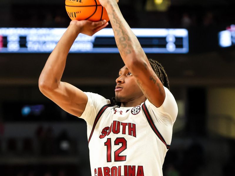 Dec 22, 2023; Columbia, South Carolina, USA; South Carolina Gamecocks guard Zachary Davis (12) shoots against the Elon Phoenix in the first half at Colonial Life Arena. Mandatory Credit: Jeff Blake-USA TODAY Sports