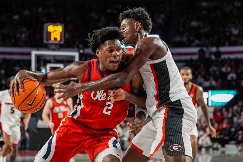 Jan 14, 2026; Athens, Georgia, USA; Mississippi Rebels guard AJ Storr (2) dribbles defended by Georgia Bulldogs forward Kanon Catchings (6) during the first half at Stegeman Coliseum. Mandatory Credit: Dale Zanine-Imagn Images