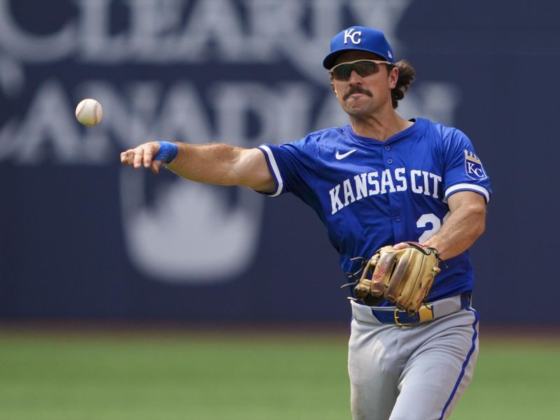 Aug 3, 2025; Toronto, Ontario, CAN; Kansas City Royals second base Adam Frazier (26) throws to first base against the Toronto Blue Jays during the fifth inning at Rogers Centre. Mandatory Credit: Kevin Sousa-Imagn Images