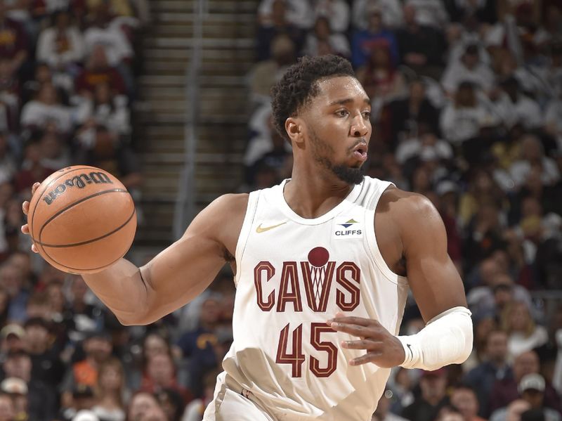 CLEVELAND, OH - APRIL 22: Donovan Mitchell #45 of the Cleveland Cavaliers handles the ball during the game against the Orlando Magic during Round 1 Game 2 of the 2024 NBA Playoffs on April 22, 2024 at Rocket Mortgage FieldHouse in Cleveland, Ohio. NOTE TO USER: User expressly acknowledges and agrees that, by downloading and/or using this Photograph, user is consenting to the terms and conditions of the Getty Images License Agreement. Mandatory Copyright Notice: Copyright 2024 NBAE (Photo by David Liam Kyle/NBAE via Getty Images)