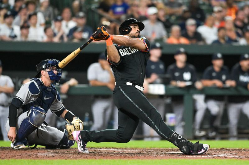 Jul 28, 2023; Baltimore, Maryland, USA; Baltimore Orioles right fielder Anthony Santander (25) swings through a walk off home run in the ninth inning against the New York Yankees  at Oriole Park at Camden Yards. Mandatory Credit: Tommy Gilligan-USA TODAY Sports