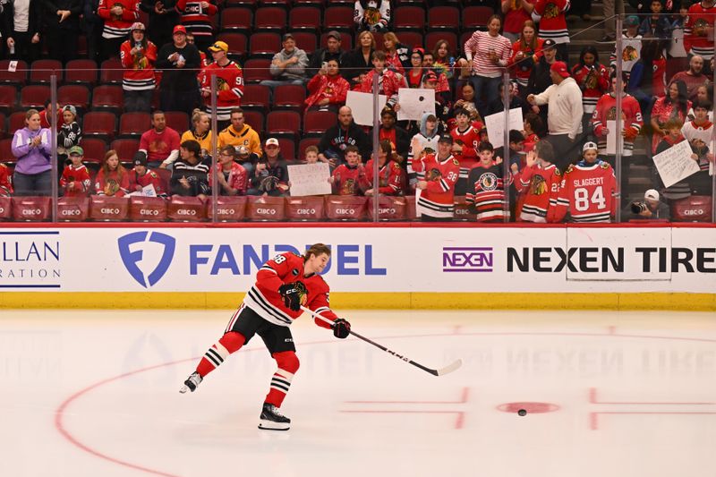 Apr 12, 2024; Chicago, Illinois, USA; Chicago Blackhawks defenseman Ethan Del Mastro (38) takes his rookie lap alone on the ice before making his NHL debut against the Nashville Predators at United Center. Mandatory Credit: Jamie Sabau-USA TODAY Sports