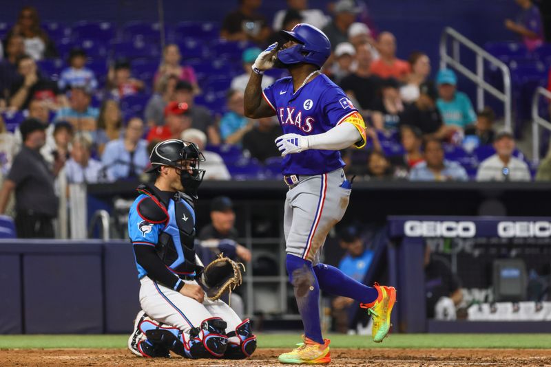 Jun 2, 2024; Miami, Florida, USA; Texas Rangers right fielder Adolis Garcia (53) scores after hitting a home run against the Miami Marlins during the sixth inning at loanDepot Park. Mandatory Credit: Sam Navarro-USA TODAY Sports