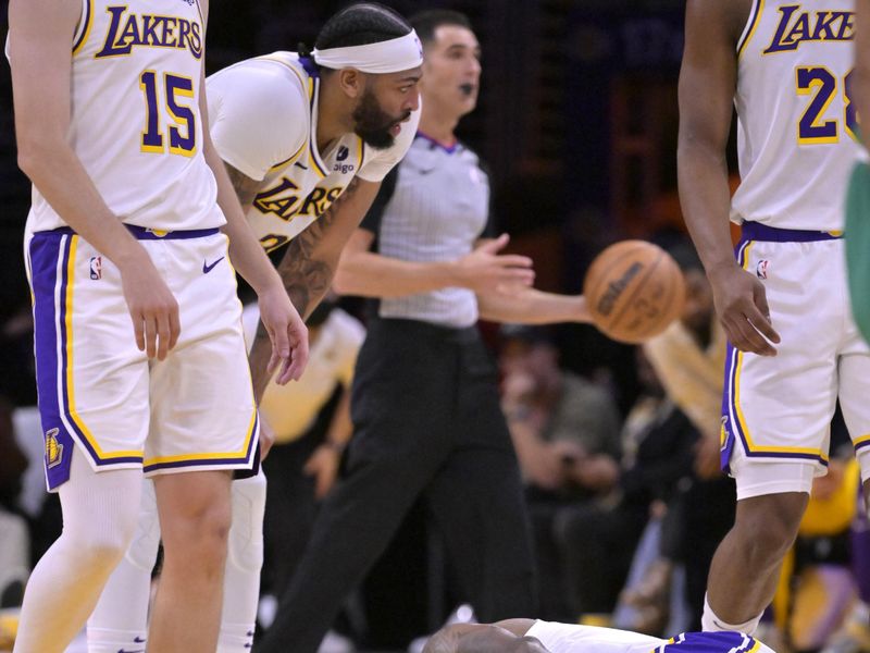LOS ANGELES, CALIFORNIA - DECEMBER 25: LeBron James #23 of the Los Angeles Lakers grimaces in pain after a collision with Jaylen Brown #7 of the Boston Celtics in the first half at Crypto.com Arena on December 25, 2023 in Los Angeles, California. NOTE TO USER: User expressly acknowledges and agrees that, by downloading and or using this photograph, User is consenting to the terms and conditions of the Getty Images License Agreement.(Photo by Jayne Kamin-Oncea/Getty Images)