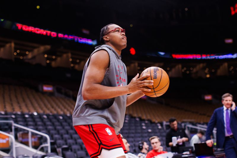 TORONTO, CANADA - DECEMBER 9: Scottie Barnes #4 of the Toronto Raptors warms up ahead of their NBA game against the New York Knicks at Scotiabank Arena on December 9, 2024 in Toronto, Canada. NOTE TO USER: User expressly acknowledges and agrees that, by downloading and or using this photograph, User is consenting to the terms and conditions of the Getty Images License Agreement. (Photo by Cole Burston/Getty Images)