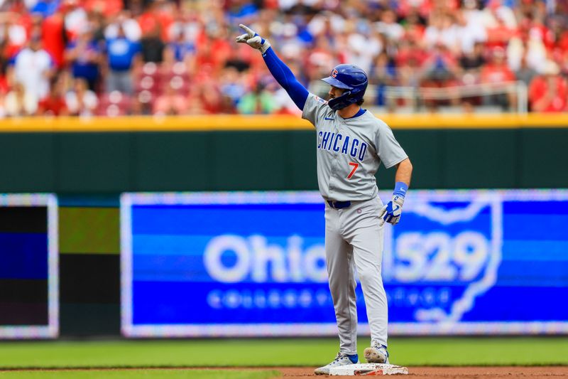 Jun 8, 2024; Cincinnati, Ohio, USA; Chicago Cubs shortstop Dansby Swanson (7) reacts after hitting a RBI double against the Cincinnati Reds in the first inning at Great American Ball Park. Mandatory Credit: Katie Stratman-USA TODAY Sports