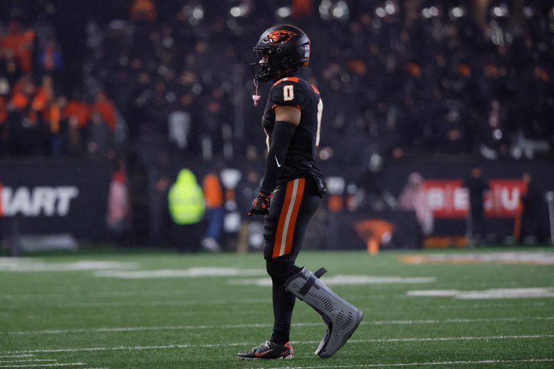 Nov 18, 2023; Corvallis, Oregon, USA; Oregon State Beavers defensive back Akili Arnold (0) walks toward the sideline during a timeout against the Washington Huskies at Reser Stadium. Mandatory Credit: Soobum Im-USA TODAY Sports