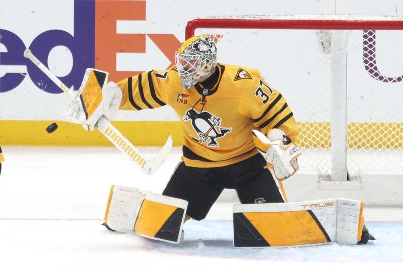 Jan 1, 2026; Pittsburgh, Pennsylvania, USA;  Pittsburgh Penguins goaltender Arturs Silovs (37) makes a save against the Detroit Red Wings during the second period at PPG Paints Arena. Mandatory Credit: Charles LeClaire-Imagn Images