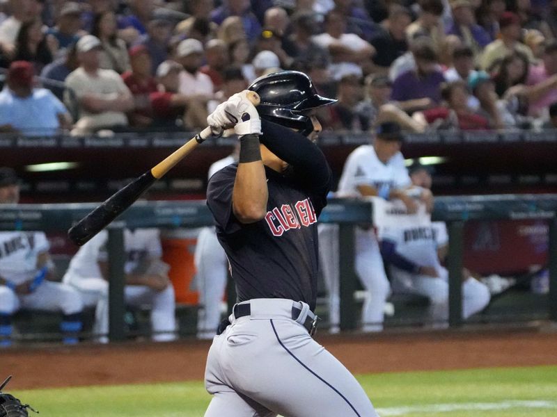 Jun 18, 2023; Phoenix, Arizona, USA; Cleveland Guardians left fielder Steven Kwan (38) hits a two RBI triple against the Arizona Diamondbacks during the second inning at Chase Field. Mandatory Credit: Joe Camporeale-USA TODAY Sports