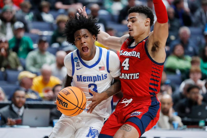 Mar 17, 2023; Columbus, OH, USA; Memphis Tigers guard Kendric Davis (3) drives to the basket defended by Florida Atlantic Owls guard Bryan Greenlee (4) in the second half at Nationwide Arena. Mandatory Credit: Joseph Maiorana-USA TODAY Sports