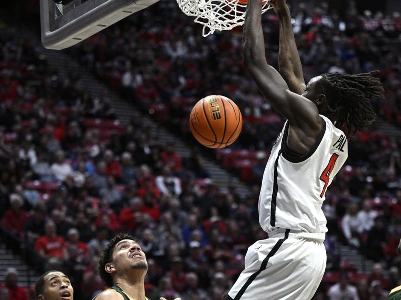 Feb 13, 2024; San Diego, California, USA; San Diego State Aztecs forward Jay Pal (4) dunks the ball during the first half against the Colorado State Rams at Viejas Arena. Mandatory Credit: Orlando Ramirez-USA TODAY Sports