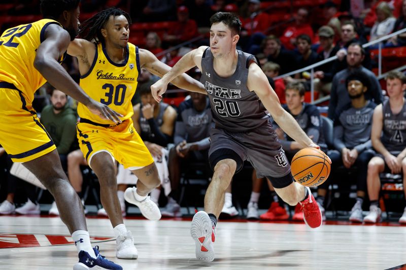 Feb 5, 2023; Salt Lake City, Utah, USA; Utah Utes guard Lazar Stefanovic (20) looks to drive against California Golden Bears guard Wrenn Robinson (30) in the second half at Jon M. Huntsman Center. Mandatory Credit: Jeffrey Swinger-USA TODAY Sports