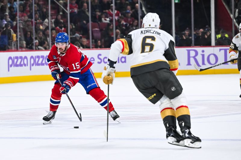 Nov 23, 2024; Montreal, Quebec, CAN; Montreal Canadiens center Alex Newhook (15) plays the puck against the Las Vegas Golden Knights during the second period at Bell Centre. Mandatory Credit: David Kirouac-Imagn Images