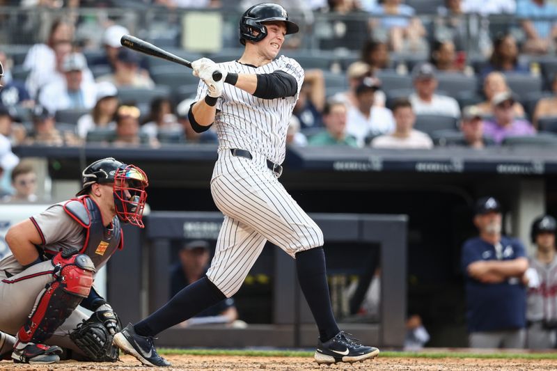 Jun 23, 2024; Bronx, New York, USA;  New York Yankees first baseman Ben Rice (93) hits a single in the seventh inning against the Atlanta Braves at Yankee Stadium. Mandatory Credit: Wendell Cruz-USA TODAY Sports