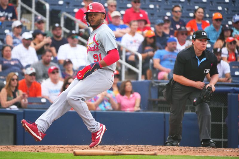 Mar 2, 2024; West Palm Beach, Florida, USA; St. Louis Cardinals outfielder Victor Scott II (91) scores a run in the seventh inning against the Houston Astros at The Ballpark of the Palm Beaches. Mandatory Credit: Jim Rassol-USA TODAY Sports