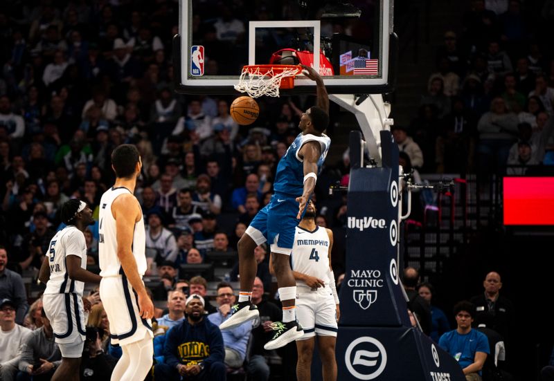 MINNEAPOLIS, MINNESOTA - FEBRUARY 28: Anthony Edwards #5 of the Minnesota Timberwolves dunks the ball in the fourth quarter against the Memphis Grizzlies at Target Center on February 28, 2024 in Minneapolis, Minnesota. NOTE TO USER: User expressly acknowledges and agrees that, by downloading and or using this photograph, User is consenting to the terms and conditions of the Getty Images License Agreement. (Photo by Stephen Maturen/Getty Images)