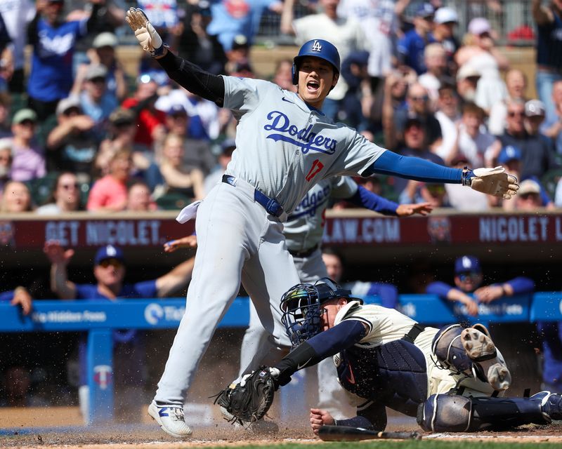 Apr 10, 2024; Minneapolis, Minnesota, USA; Minnesota Twins catcher Christian Vazquez (8) tags out Los Angeles Dodgers designated hitter Shohei Ohtani (17) at home plate during the seventh inning at Target Field. Mandatory Credit: Matt Krohn-USA TODAY Sports